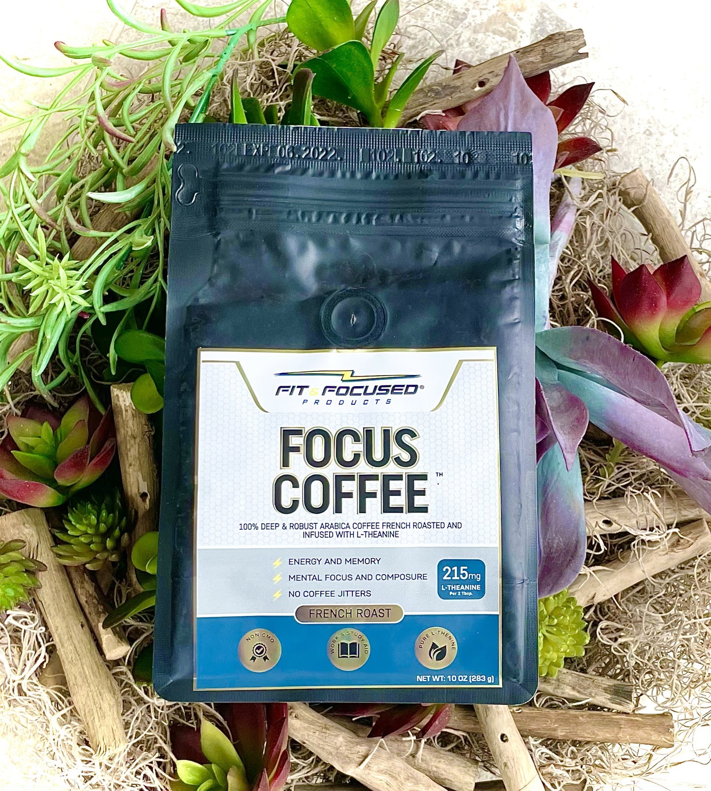 L-Theanine Infused Focus Coffee Laying In A Bouquet Of Plants Such As Green Tea Leaves
